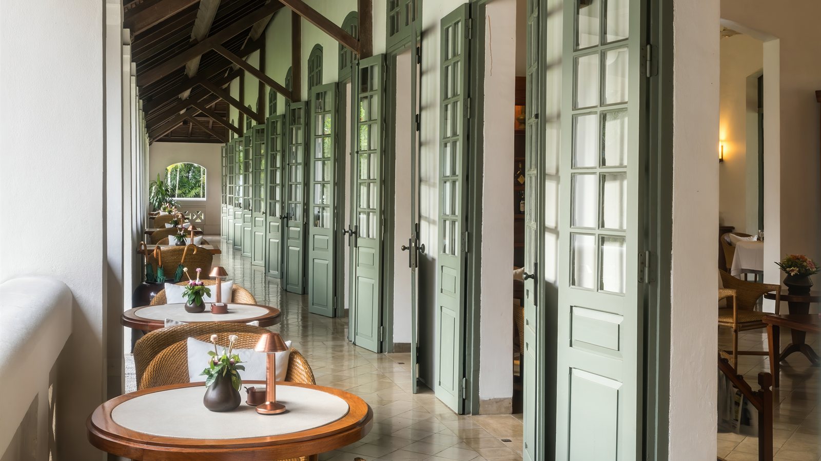 Dining room with round tables set for lunch